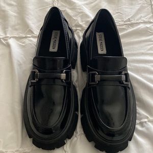 Steve Madden platform lug sole loafer with Patent leather, gun metal hardware.